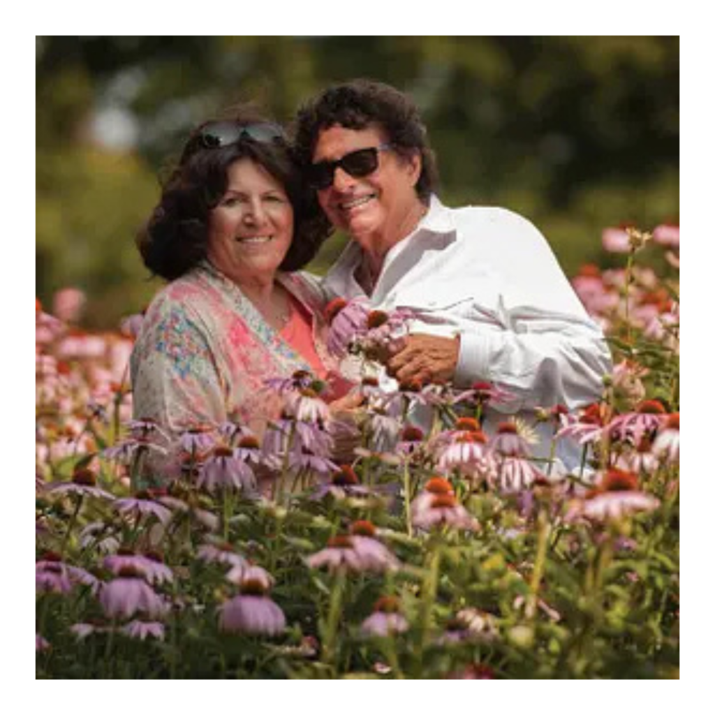 Frank Senior and Josephine inspecting Echinacea botanical crops